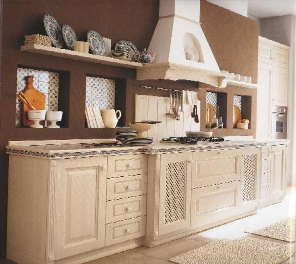 Cucina realizzata con anta in legno di frassino con finitura decap bianco o azzurro. Possibilit di inserire antine a vetro all'inglese o con griglia in legno.